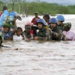 Troops rescue flood victims