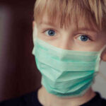Boy in surgical mask