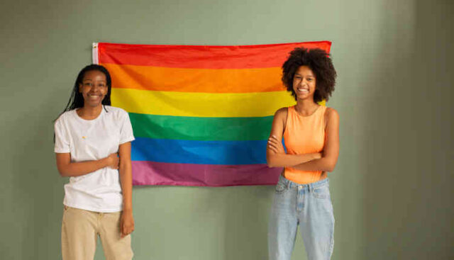 Two women with rainbow flag