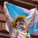 Woman waving trans flag