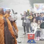 Buddhist monks greeted enthusiastically wherever they go